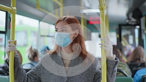 Female passenger wearing gloves wears medical mask following modern precautions in public places to protect against
