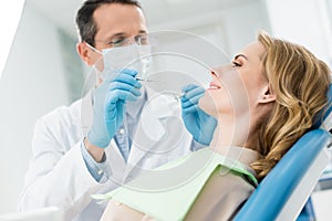 Female patient at dental procedure in modern