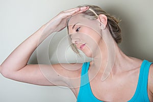 Female patient do head healthy pressure exercises