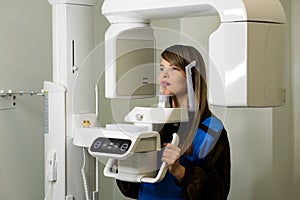 Female patient having computer tomography of jaw