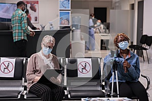 Female patient with impairment sitting in hospital reception