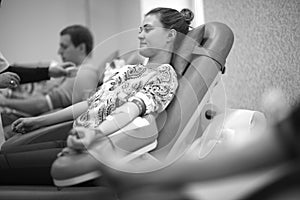 Female patient in medical chair waiting for a nurse