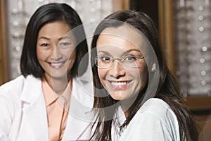 Female Patient And Optician At Optometrists