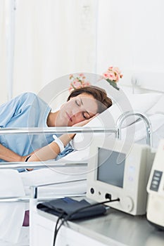 Female patient sleeping in medical bed