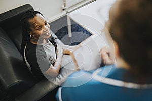 Female patient speaking to a nurse photo