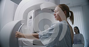 Female patient undergoing mammography screening procedure