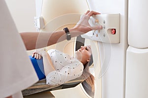 Female patient undergoing MRI - Magnetic resonance imaging in Hospital. Medical Equipment and Health Care concept