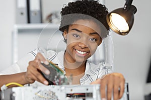 Female pc technician fixing pc