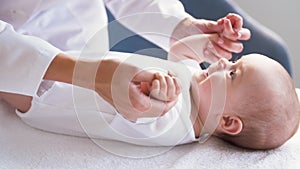 Female pediatrician doctor with baby at clinic