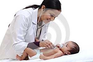 Female pediatrician examine newborn baby photo