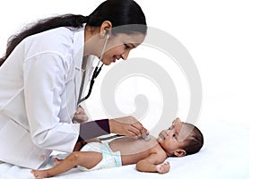 Female pediatrician holds newborn baby photo