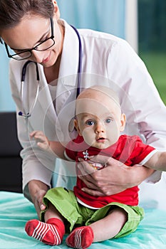 Female pediatrician with little boy