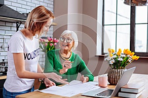 Female on pension having conversation about documents with social employee