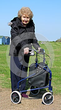 Female pensioner with delta walking aid