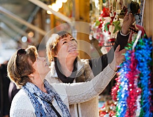 Female pensioners buying X-mas decorations