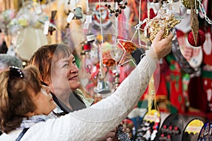 Female pensioners buying X-mas decorations