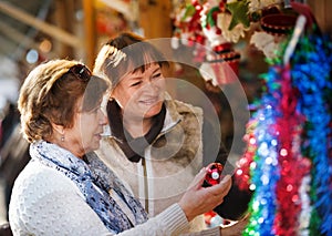 Female pensioners buying X-mas decorations