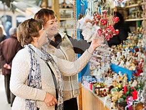 Female pensioners buying X-mas decorations