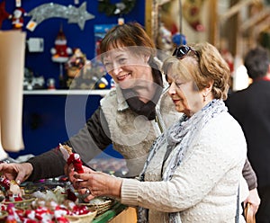 Female pensioners buying X-mas decorations