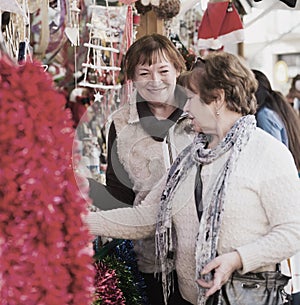 Female pensioners buying X-mas decorations