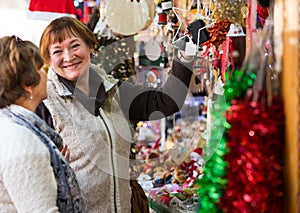 Female pensioners buying X-mas decorations