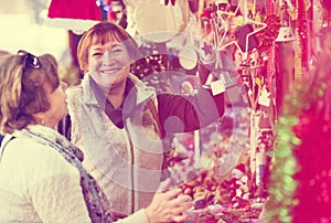 Female pensioners buying X-mas decorations