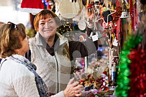 Female pensioners buying X-mas decorations