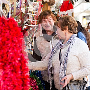 Female pensioners buying X-mas decorations