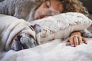 Female people living happy with a dog. One woman pet owner sleeping with her best companion friend together on bed. Love and