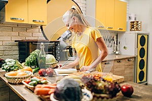 Female person cooking on the kitchen, organic food