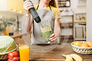 Female person cooking, mixing healthy organic food