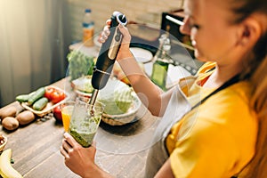 Female person cooking, mixing healthy organic food