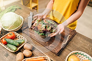 Female person cooking salad, healthy organic food