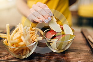 Female person hand with apple piece, healthy food