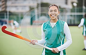 Female, person and happy for hockey with stick in hand on field for training in portrait. Girl, hold and smile with