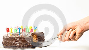 Female person serving a homemade sacher chocolate cake