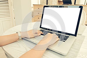Female person sitting front open laptop computer and smart phone with blank empty screen for your information or content.