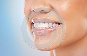 Female person, smile and zoom for treatment, filling and polish for cosmetic in blue background. Teeth, closeup and