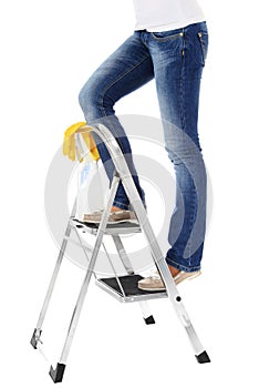 Female person on step ladder