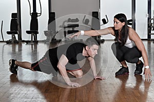 Female personal trainer working with her trainee