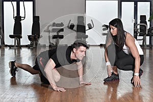 Female personal trainer working with her trainee