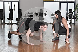 Female personal trainer working with her trainee