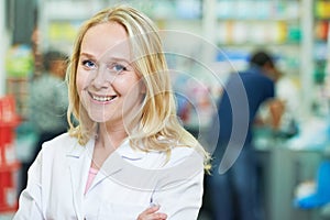 female pharmaceutical worker portrait in drugstore