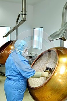 Female pharmacist works in a factory.Production of medicines, pi