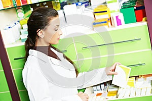 Female pharmacutical chemist at drugstore