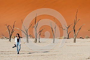 Female photographer in deadvlei, Namibia