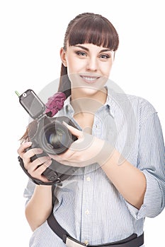 Female Photographer Holding a Professional Camera and Smiling