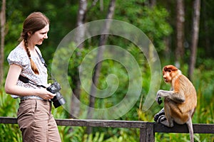 Female photographer and proboscis monkey