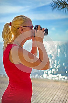 Female Photographer by Seaside