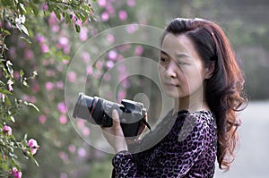 A female photographer in sunshine